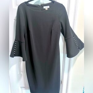 Black Calvin Klein cocktail dress.